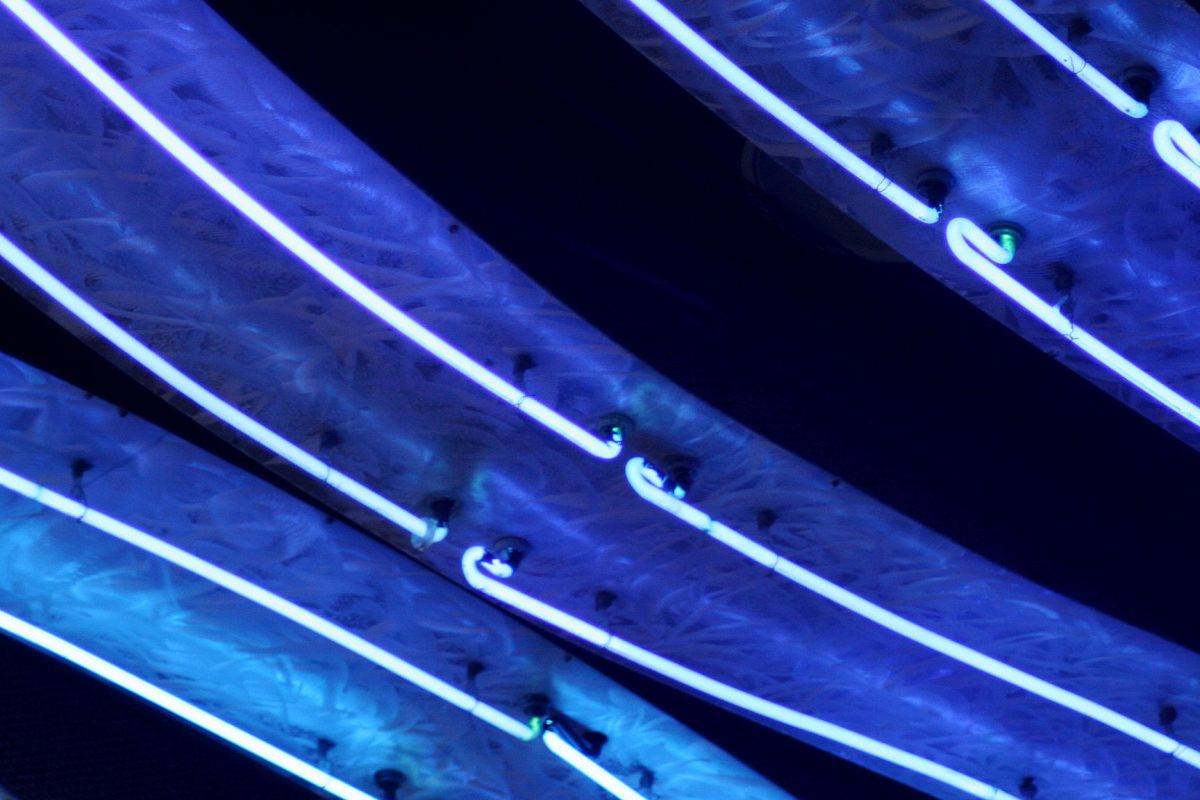 Cool blue architectural neon accent glow along a structural cove edge